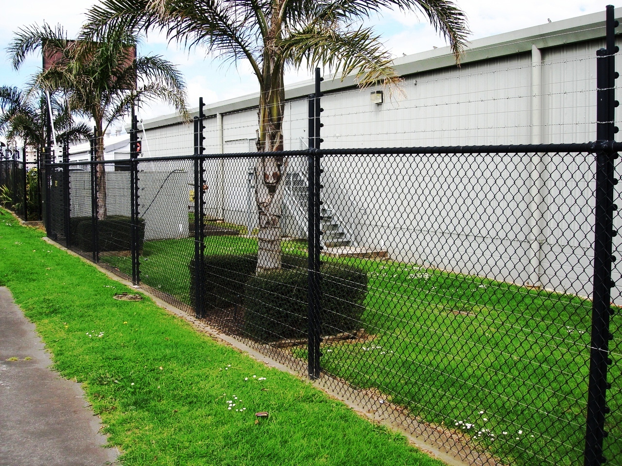 Black powder coated pipe and mesh security fence with electrics